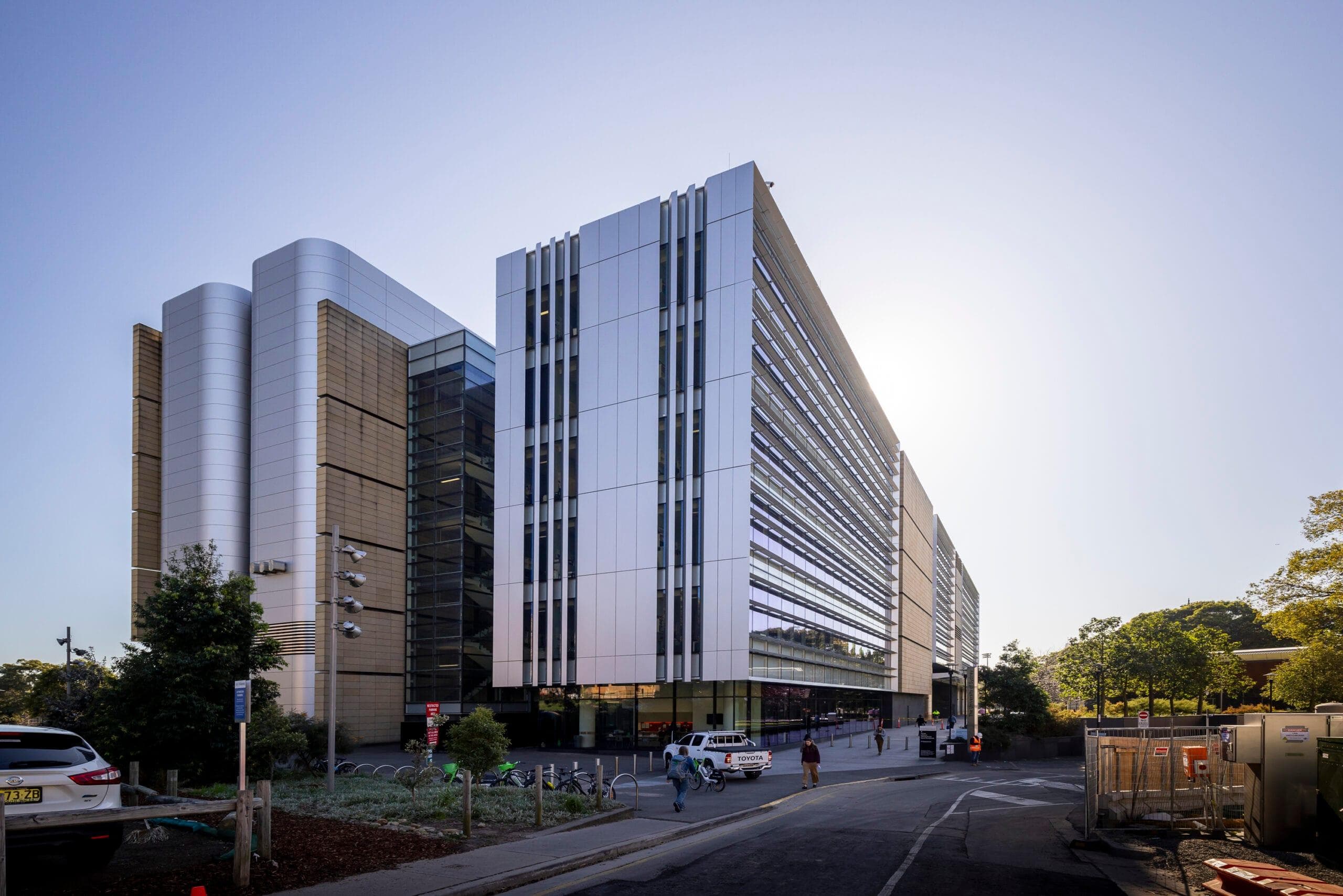 Close-up of Alpolic NC silver curved panels at the Charles Perkins Centre, showcasing smooth architectural detailing.