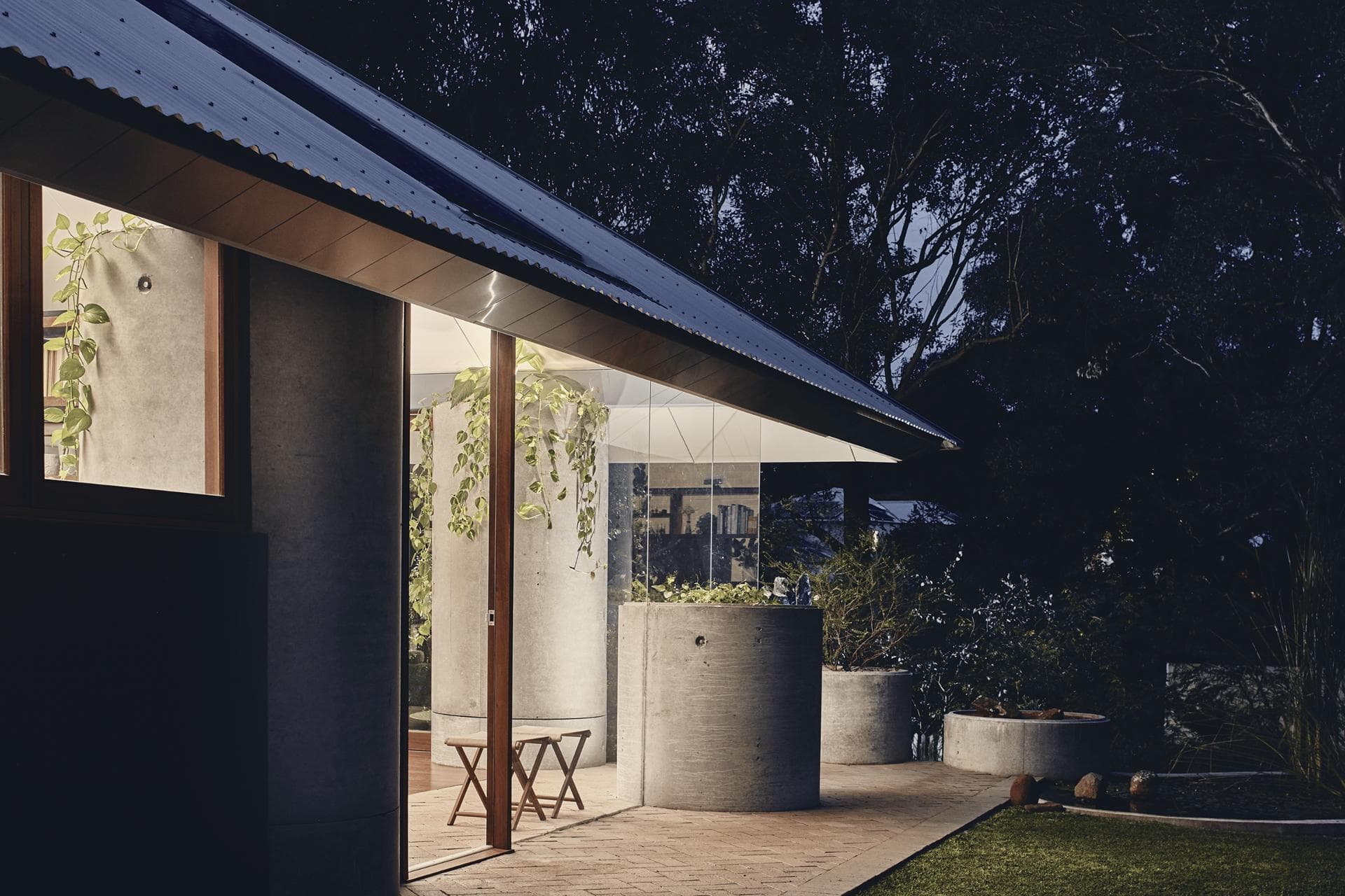 Evening exterior showing ALPOLIC™/fr cladding extending from ceiling to eaves at Celilo Springs