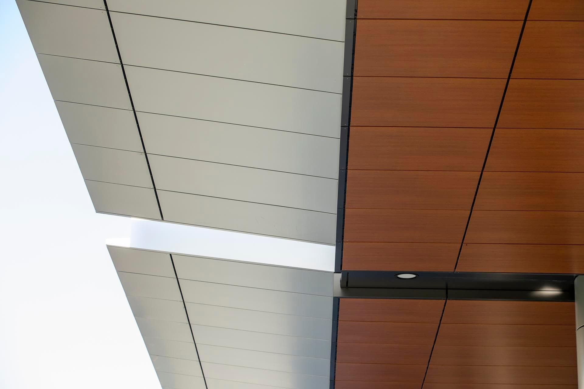 Close-up view of Alpolic NC aluminium composite panels in silver and woodgrain finish on the soffit of the Charles Perkins Centre.