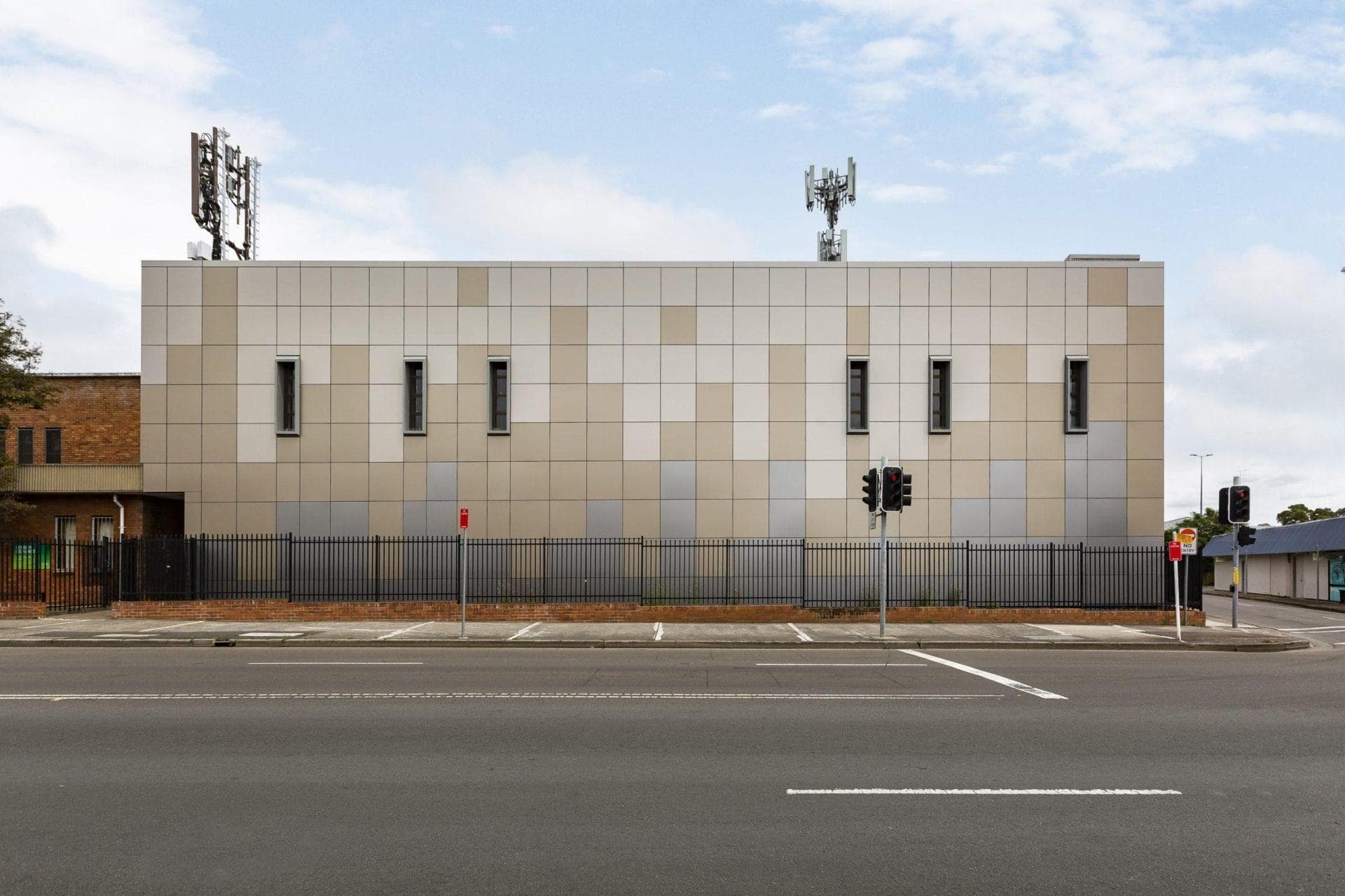 Elevation of Telstra Data Exchange Penrith showing ALPOLIC™ NC/A1 panel layout in bronze and grey tones