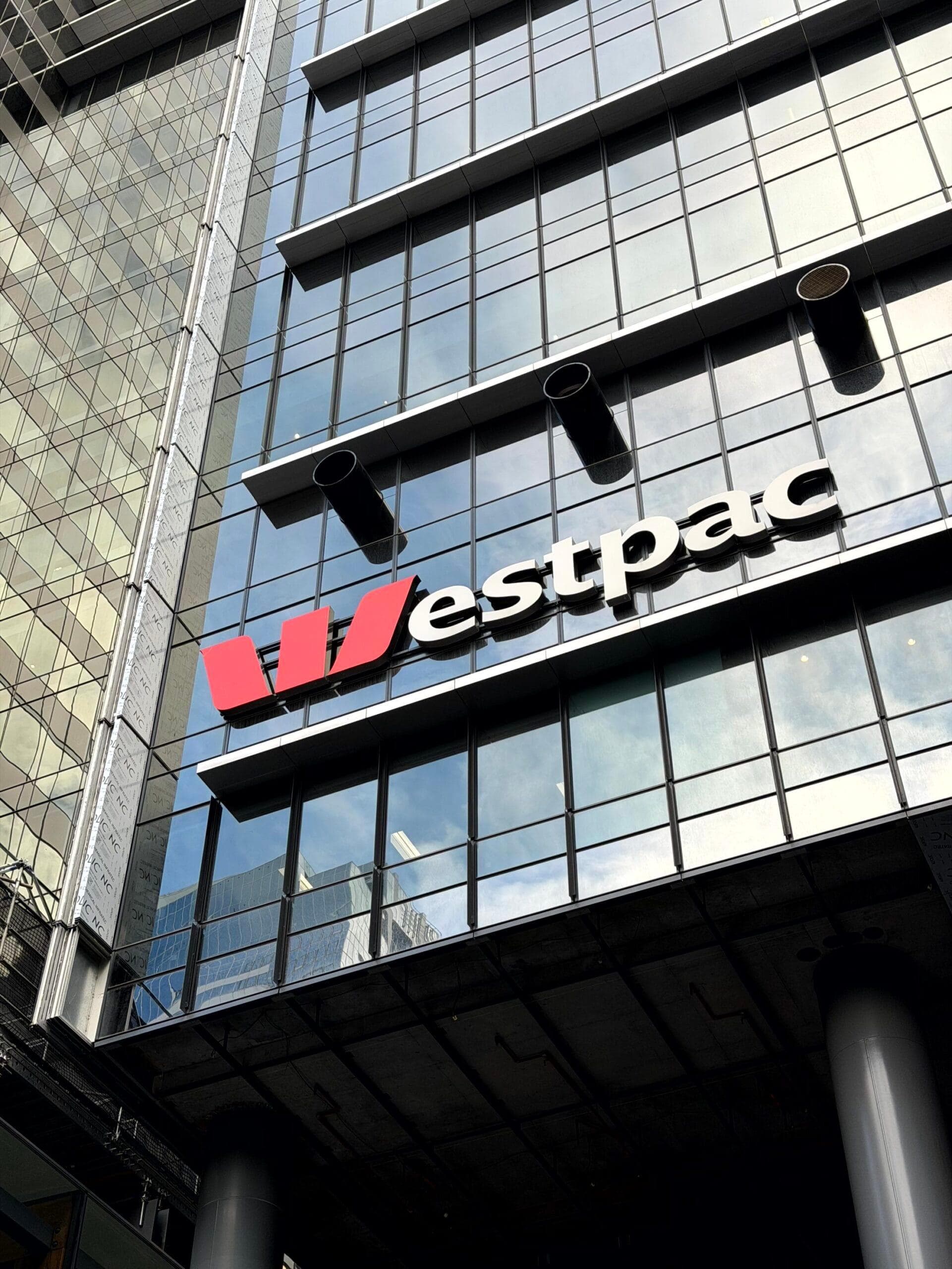 Westpac signage mounted on the glass façade beside ALPOLIC™ recladding panels
