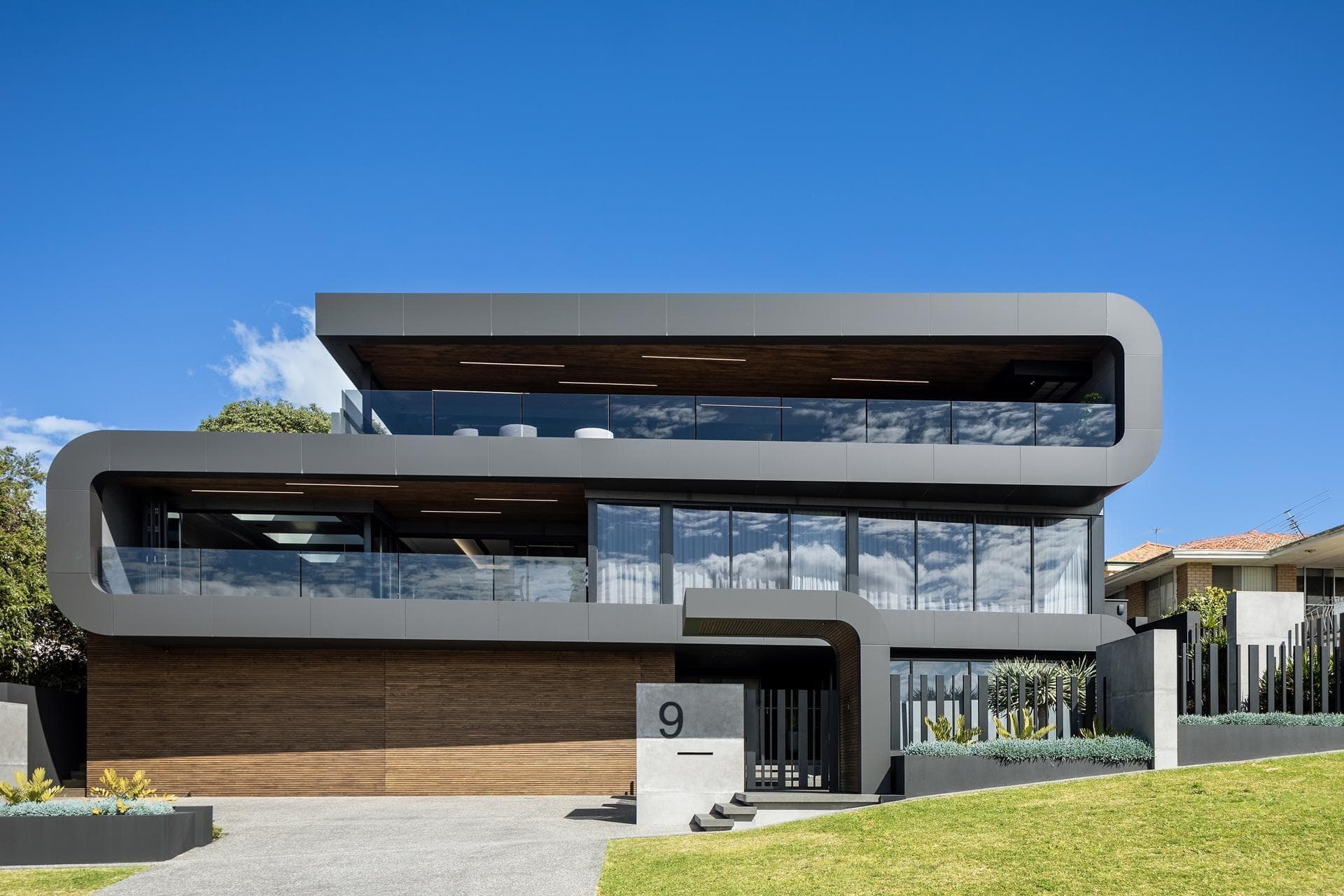 Daytime front view of 9 Stoke Street featuring ALPOLIC™/fr Matte Slate Black panels and contemporary design lines