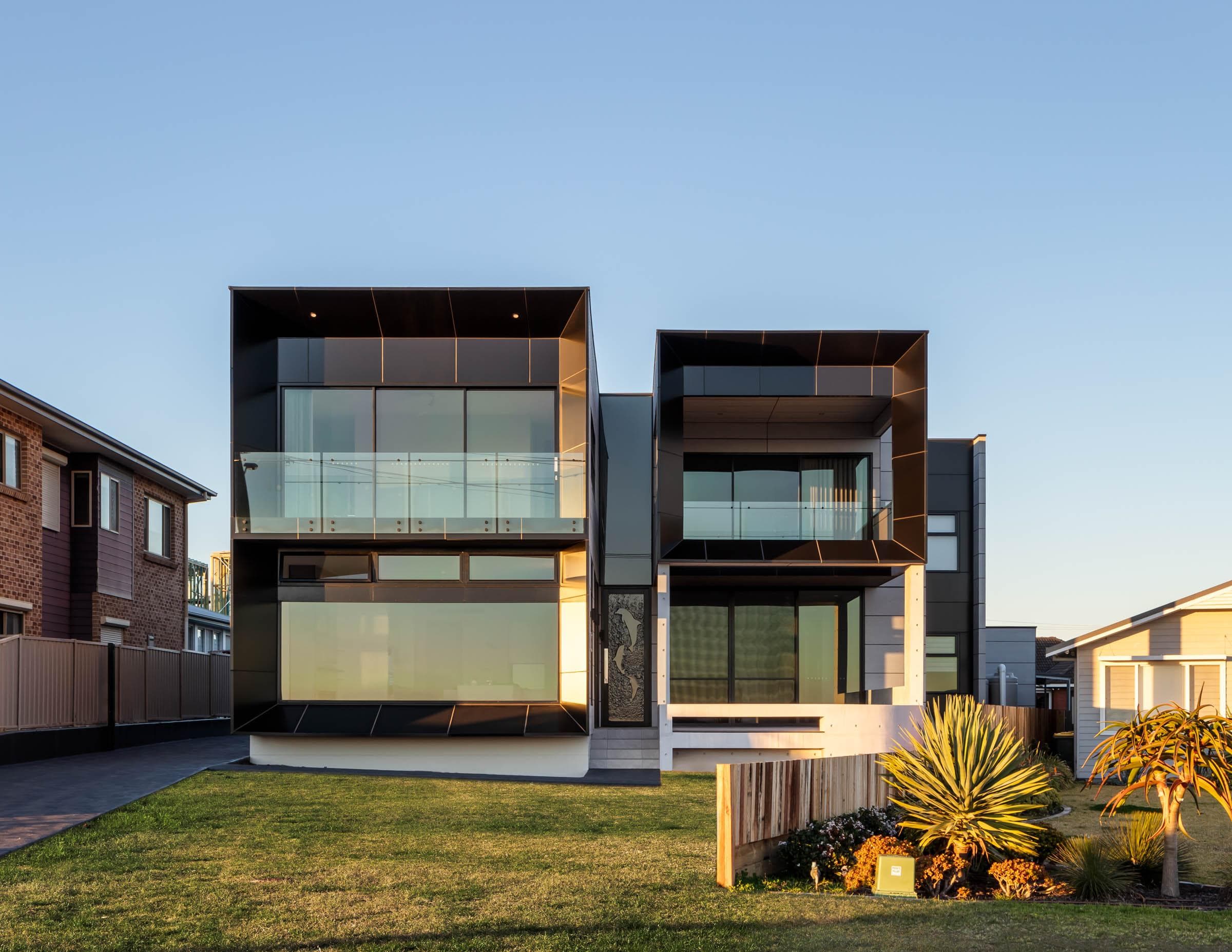 Front elevation of The Icon residence featuring ALPOLIC™/fr Monotone Slate cladding and glass balconies